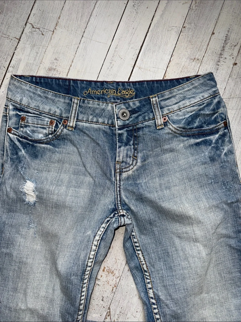 American Eagle Outfitters faded blue distressed jeans